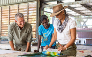 Travellers screen printing with an Aboriginal guide at Tiwi Design