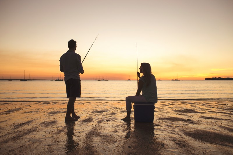 Couple fishing at mindil beach with sunset