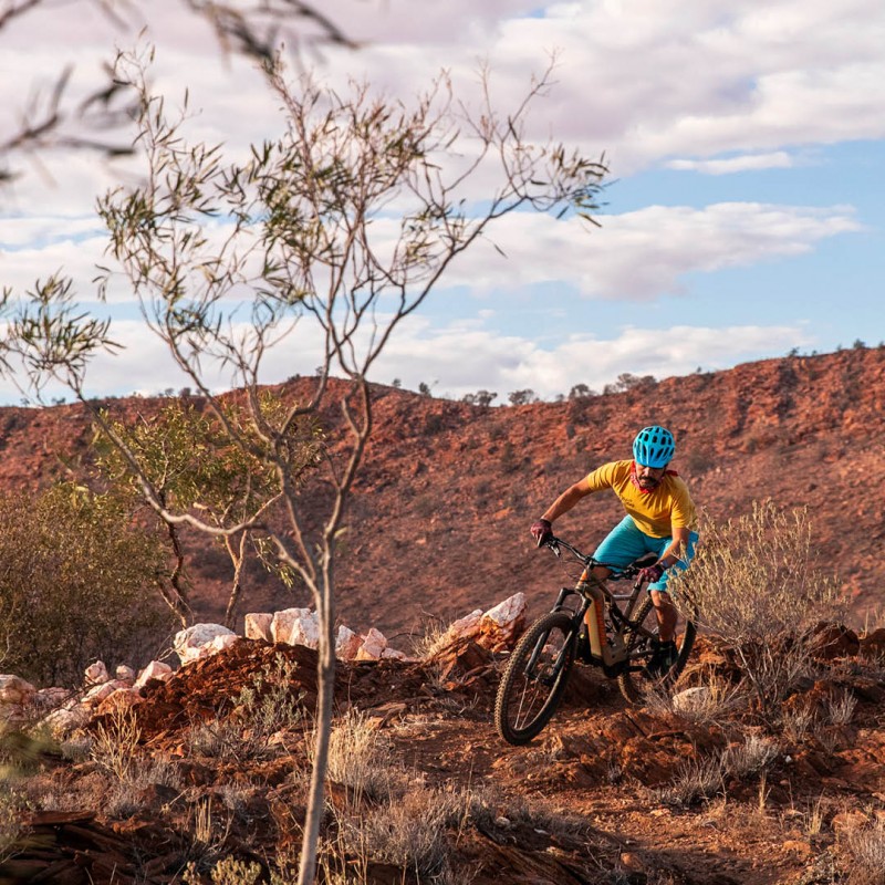 man riding mountain bike trail