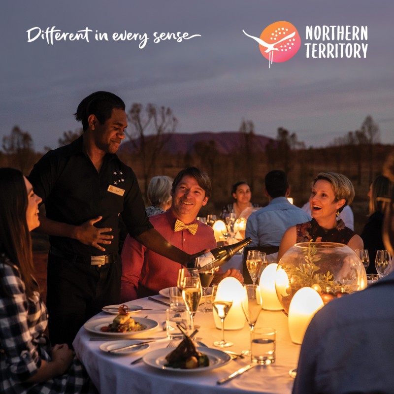 image of outdoor diners being served by waiter in Uluru 