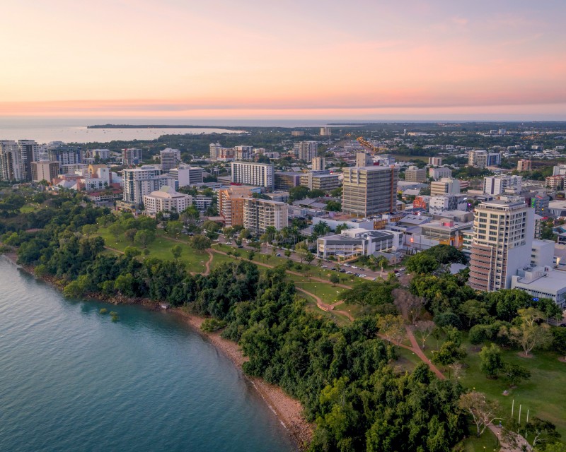 Aerial view over Darwin City and harbour coastline at sunset