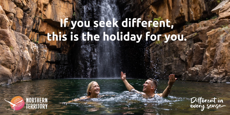 Image of a couple in Southern Rockhole waterfall, with text saying 'If you seek different, this is the holiday for you'